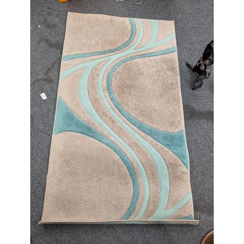 401 - Brand new Dunelm Teal patterned rug 80 x 150 cm