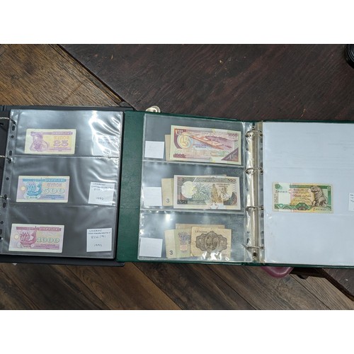 463 - Two albums with assorted foreign bank notes