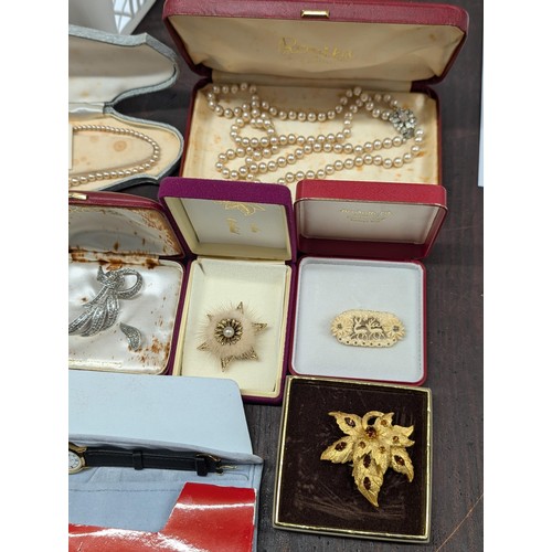 525 - Basket of cased and boxed, mostly vintage costume jewellery, brooches and watches