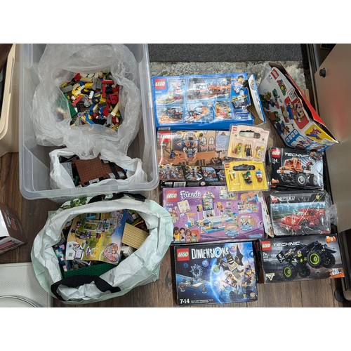 420 - Large tub of Lego both boxed and loose, including Mario, Friends, Technics and Harry Potter etc