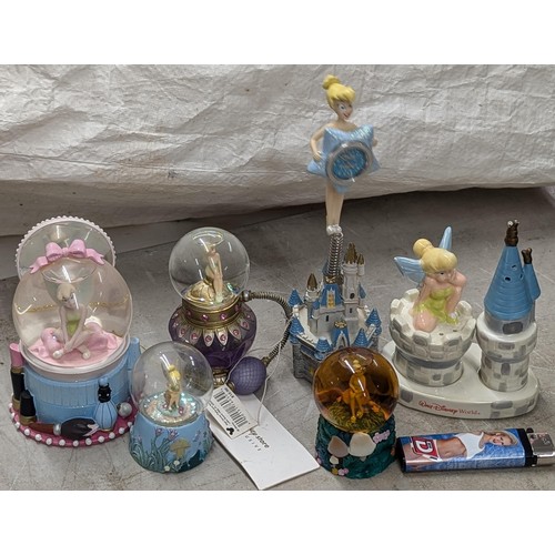 218 - Small collection of Disney Tinkerbell snow globes, desk clock and salt/pepper set