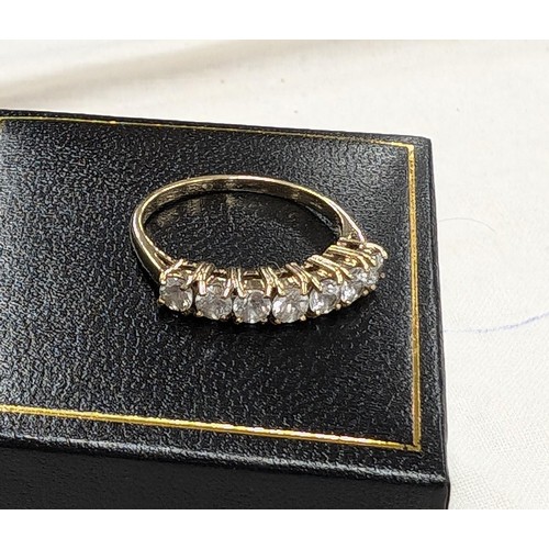 569 - 375 hallmarked, 9 carat gold ring set with 7 x 1/10 carat diamonds size N 1/2 - 2.1 gm