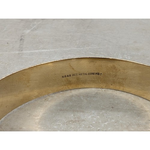 565 - HG & S stamped 9 ct metal core bangle with half engraved patterning