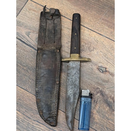 156 - Vintage bowie knife with wooden handle and brass hilt in leather sheath