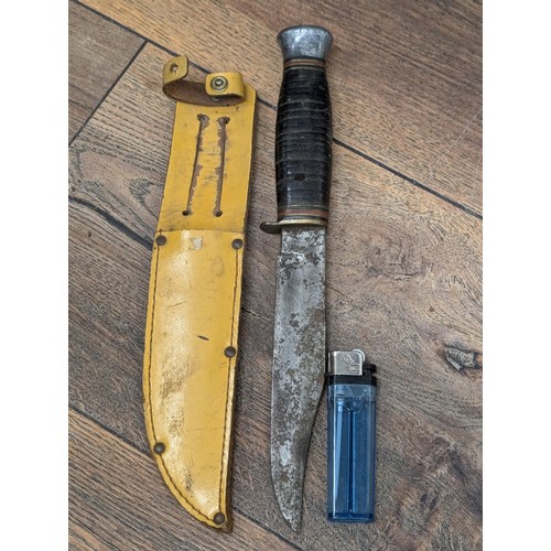 153 - Vintage Bowie/scout knife in leather yellow sheath