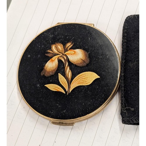 448 - Vintage gold tone Stratton compact with flower details in pouch.