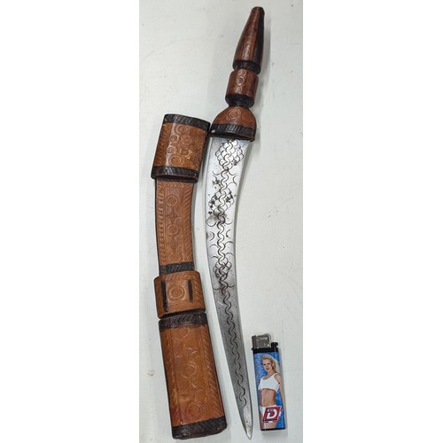 161 - Large Middle Eastern tribal knife with leather handle and in leather scabbard