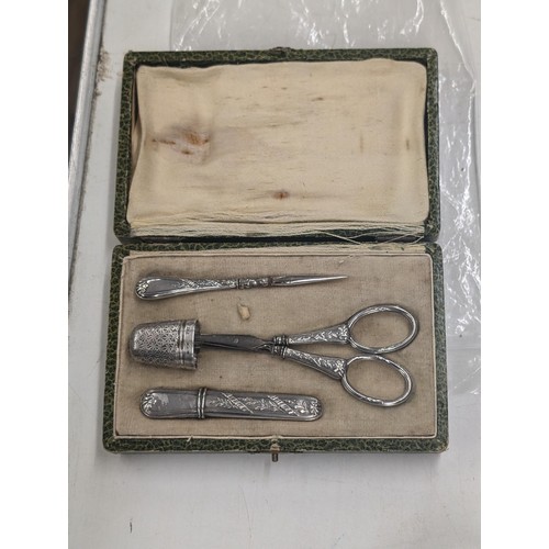 447 - Unmarked silver sewing set in original box with non-matching not silver thimble