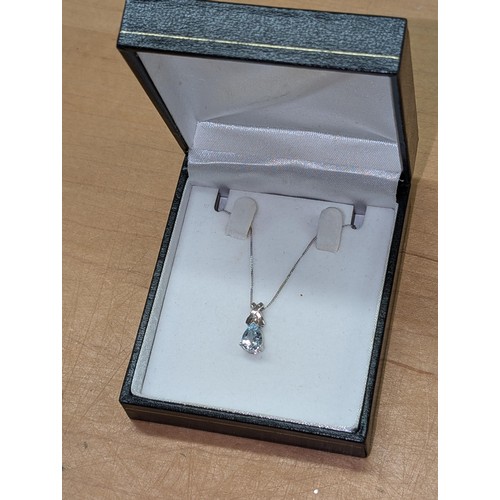 593 - Hallmarked 9CT white gold Aquamarine and illusion diamond pendant necklace in box