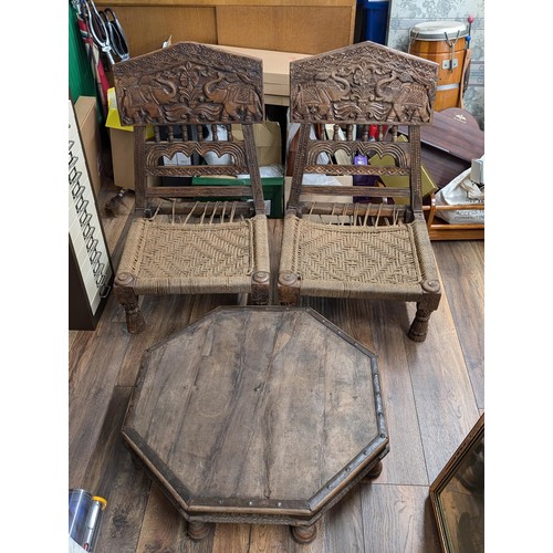 234 - Pair of Indian carved folding chairs with low table