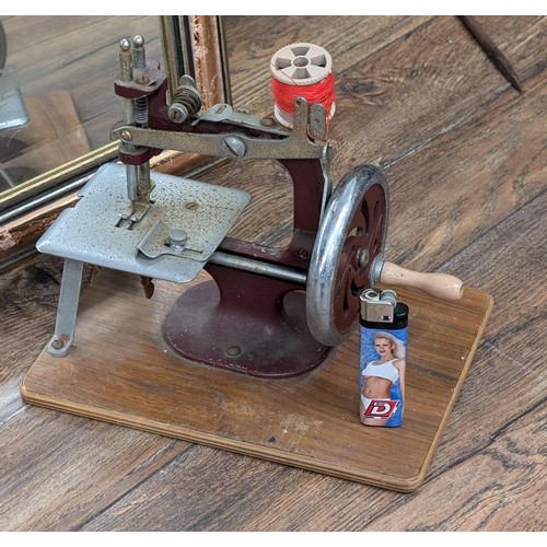 38 - Vintage Miniature sewing machine - moves but a little stiff