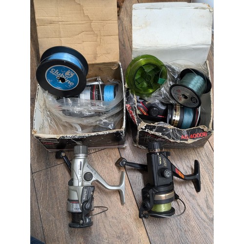 403 - Collection of fishing reels being boxed Shakespeare Omni 010, Daiwa AG4000B, Ryobi and other Daiwa