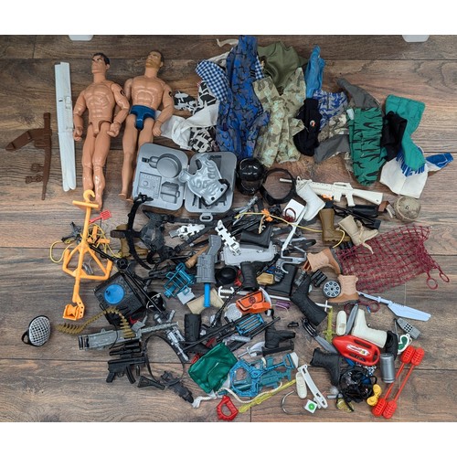 519 - 2 x Action men with bundle of clothes and accessories etc