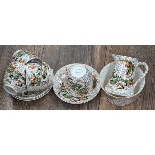 501 - TF & S LTD phoenix ware set of 4 cups and saucers, milk jug and sugar bowl (hairline crack)