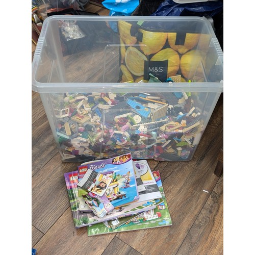 392 - Large storage box (lid broken) approximately 1/3 full of Lego friends loose building set etc