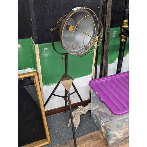 390 - Antique bronze look metal industrial style tripod floor lamp, battery powered and as found