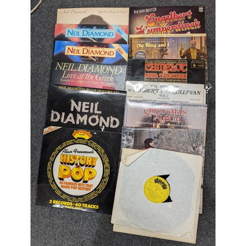 40 - Portable vinyl album case with assorted vinyl albums and singles in varying conditions