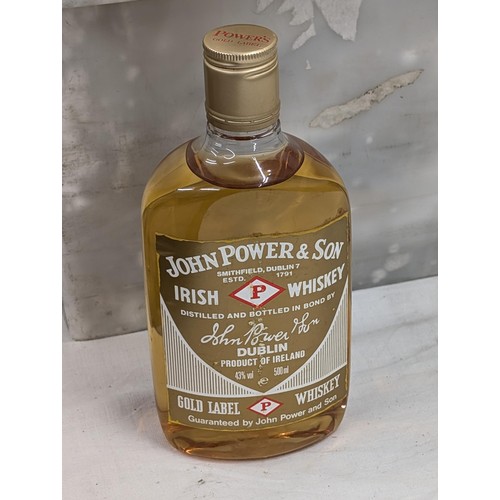 8 - Unopened 500 ml John Power Irish whiskey (plastic bottle) and matching whiskey glass