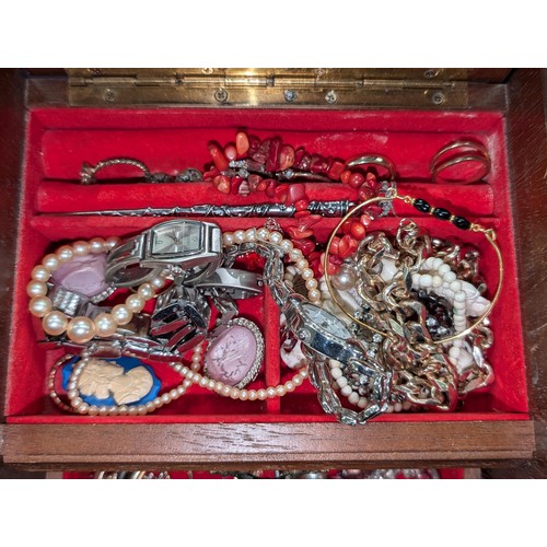 297 - Small single drawer musical jewellery box with mixed costume and dress jewellery and watches etc