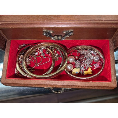 297 - Small single drawer musical jewellery box with mixed costume and dress jewellery and watches etc