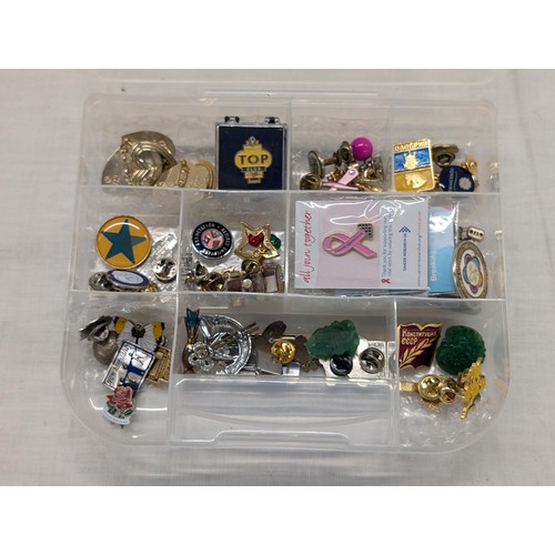 53 - Plastic box with assorted pin badges etc