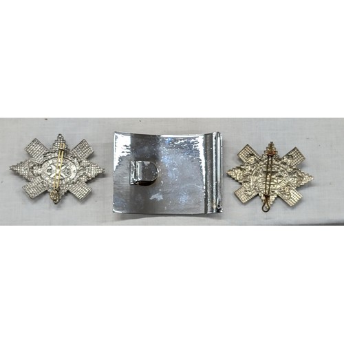 149 - South Ayrshire highlander belt buckle and 2 x Scottish cap badges