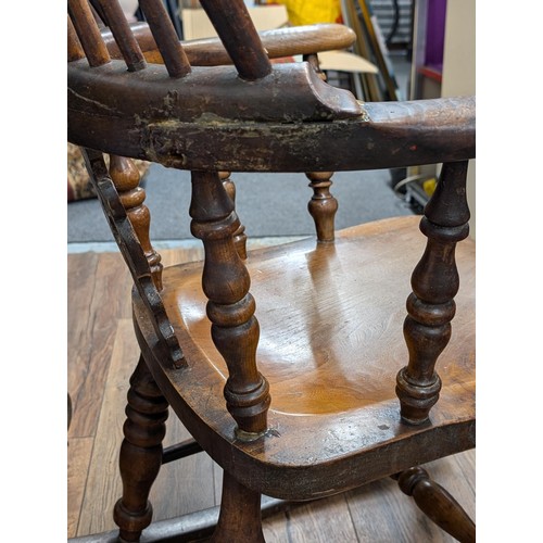 371 - Antique wooden Windsor rocking chair - with crude repair work