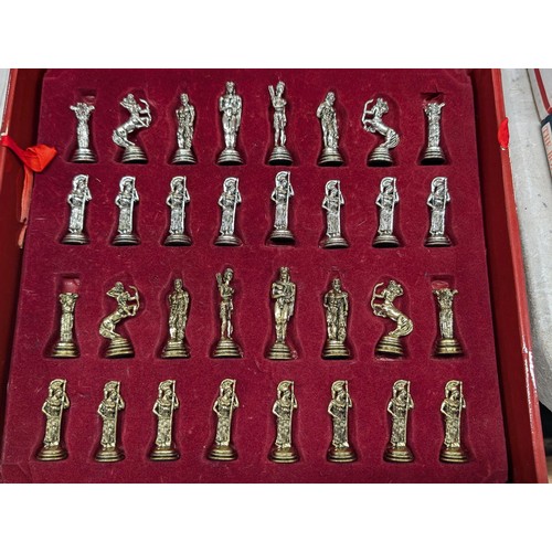 247 - Boxed near mint Greek souvenir ware metal chess set with 12.5 x 12.75