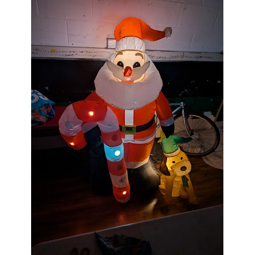 2 - Approximately 5.5 ft tall clear (multi-chasing) light up, indoor or outdoor inflatable santa with do... 