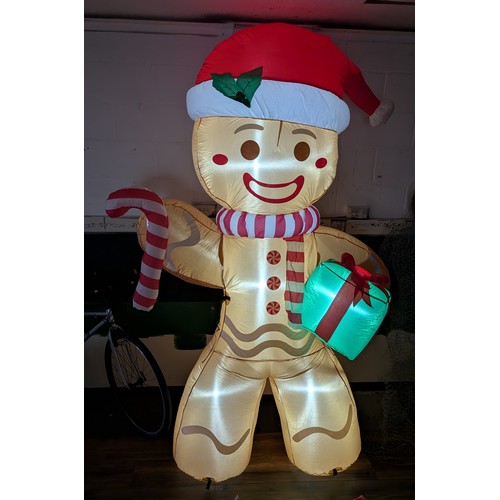 5 - Approximately 8 ft tall clear static light up, indoor or outdoor inflatable large gingerbread man ho... 