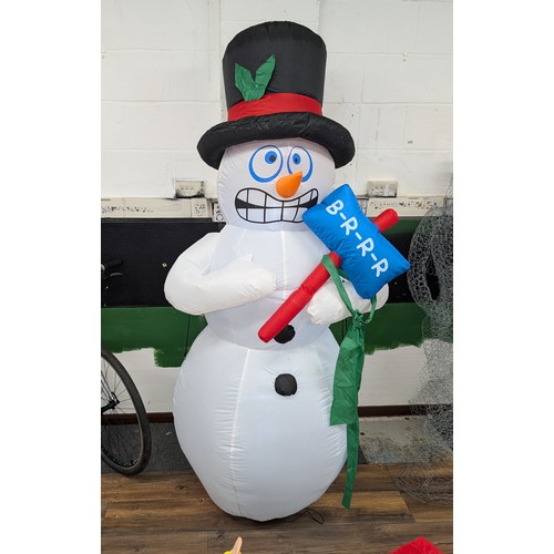 6 - Approximately 7 ft tall clear static light up, indoor or outdoor inflatable snowman