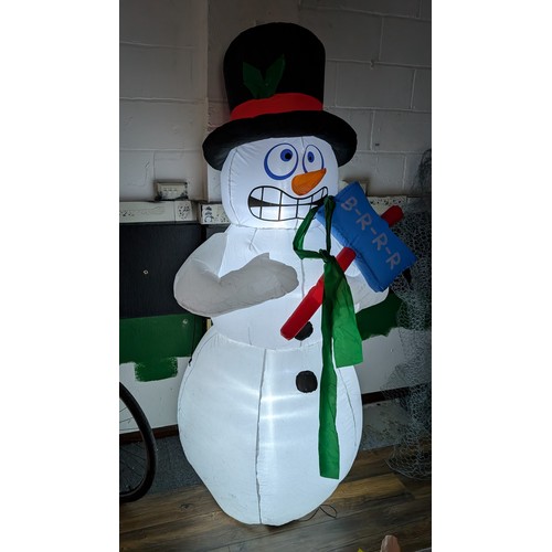 6 - Approximately 7 ft tall clear static light up, indoor or outdoor inflatable snowman