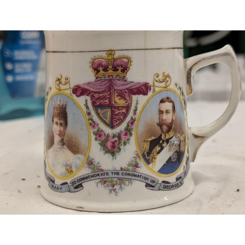 1057 - 1911 King George V coronation teapot (damage on spout) and mug (hairline crack)