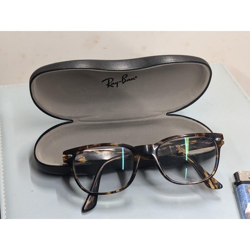 448 - Pair of genuine cased Rayban prescription glasses with built in reactors (cost nearly £600)