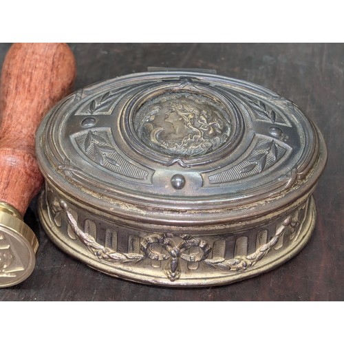 55 - Small oval metal trinket pot with repousse detail, coat of arms wax stamp and large 3-sided rotating... 