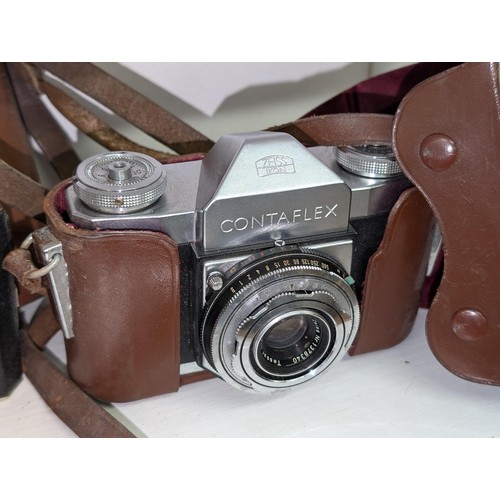 73 - Trio of vintage cameras in cases being Minolta AF-S (in old Ilford case), Kodak folding and Zeiss Ik... 