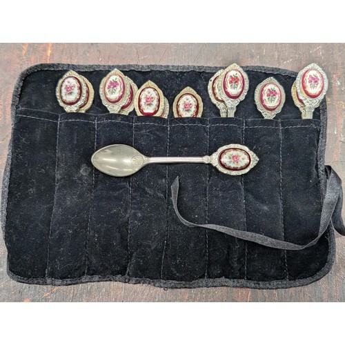 47 - Set of 12 x silver plated teaspoons, with painted floral porcelain tops, in cutlery pouch