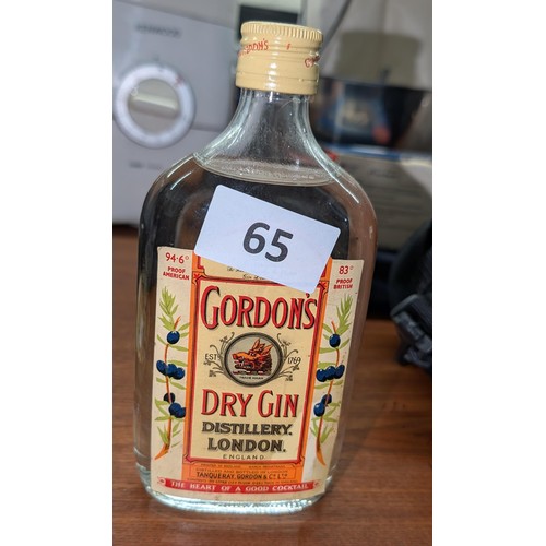 65 - Unopened vintage Gordons half bottle dry gin