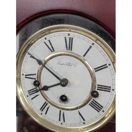 250A - Working London Clock Co antique look pendulum wall clock, approximately 26