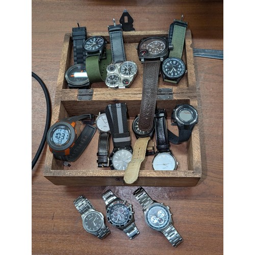 267 - Carved wooden jewellery box with assorted watches - sold as seen mostly none working - may need batt... 