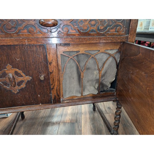 232 - 1920/30s Fullotone sound box wind up record player in Oak cabinet with assorted 78s and long play re... 