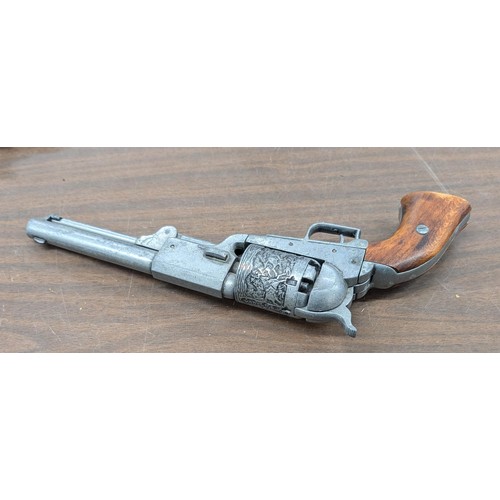 361 - Detailed replica pewter 1849 Colt Dragoon revolver with wooden grip and decorative engraving.