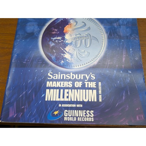 173 - Complete Sainsbury's makers of the millennium coin collection in booklet folder with winners medal. ... 