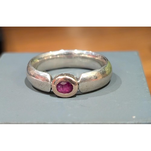 440 - Thick silver ring with ruby in gold mount size