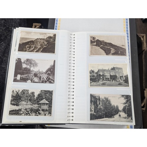 184 - Postcard album with 300 x mainly black and white mixed postcards - unposted dating early 1900s upwar... 