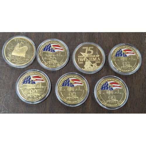 116 - Collection of cased Commemorative gold plated and enamel coins being Pearl Harbour,Titanic and Battl... 