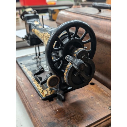 47 - Vintage Jones Family CS hand crank sewing machine, serial number 28779, with wooden case and key pre... 