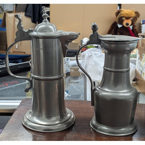 9 - Two large heavy Pewter tankards with lids, one being engraved