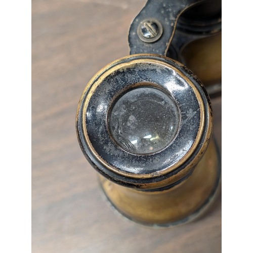 131 - Pair of 1895 French horse racing binoculars - couple of dents and lens damaged but doesn't affect th... 