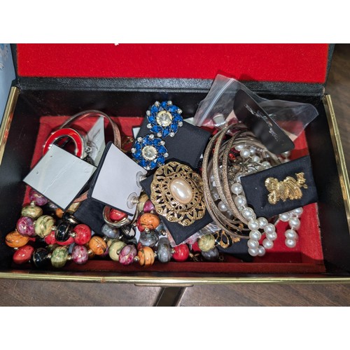 267 - Jewellery box and case with large amount of assorted dress and fashion jewellery